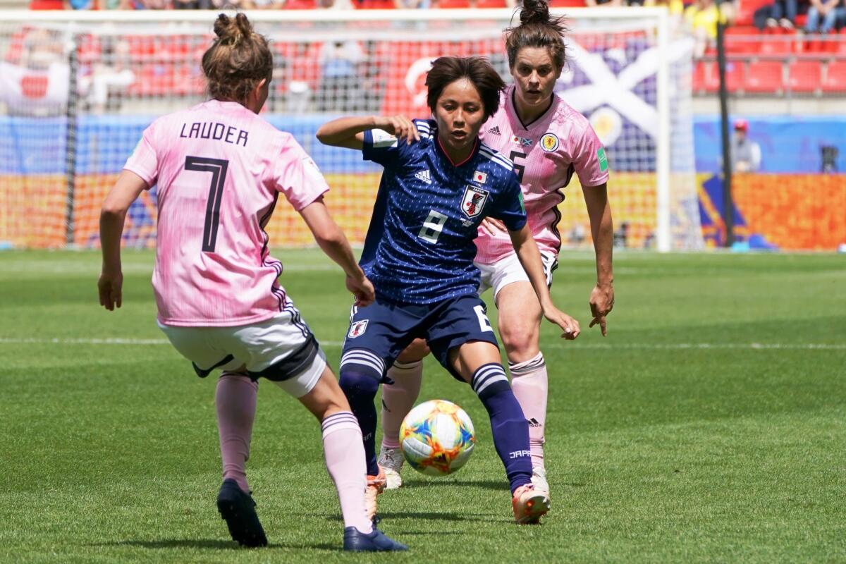 Japan's Mana Iwabuchi tries to get past Scotland's Hayley Lauder during a Women's World Cup match Friday in Rennes, France.