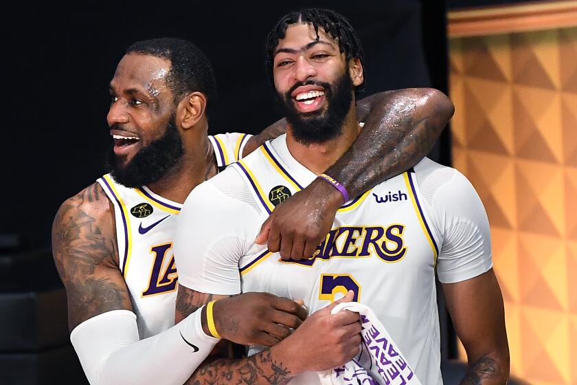 LeBron James, left, and Anthony Davis celebrate in the closing seconds of Game 6 of the NBA Finals