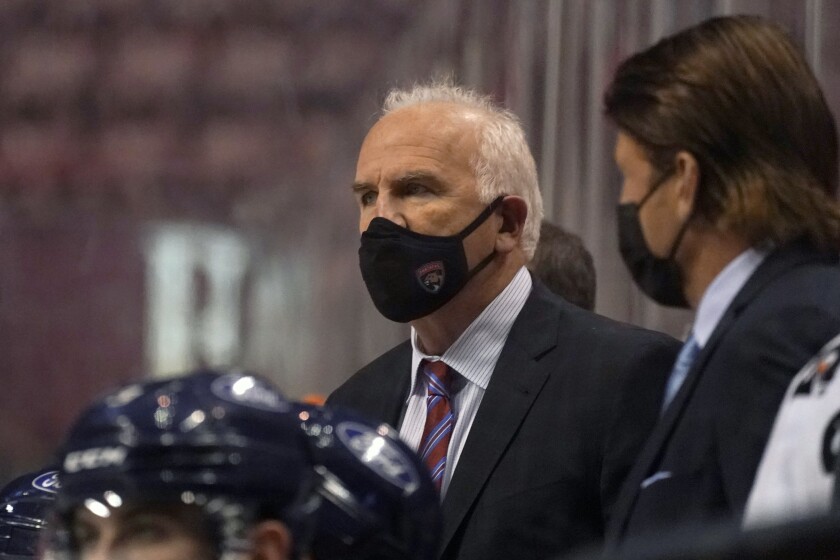 FILE - In this Friday, Feb. 5, 2021 file photo, Florida Panthers head coach Joel Quenneville looks on during the third period of an NHL hockey game against the Nashville Predators in Sunrise, Fla. Florida Panthers coach Joel Quenneville has offered to participate in the Chicago Blackhawks' review of allegations by a former player who says he was sexually assaulted by a then-assistant coach in 2010(AP Photo/Wilfredo Lee, File)