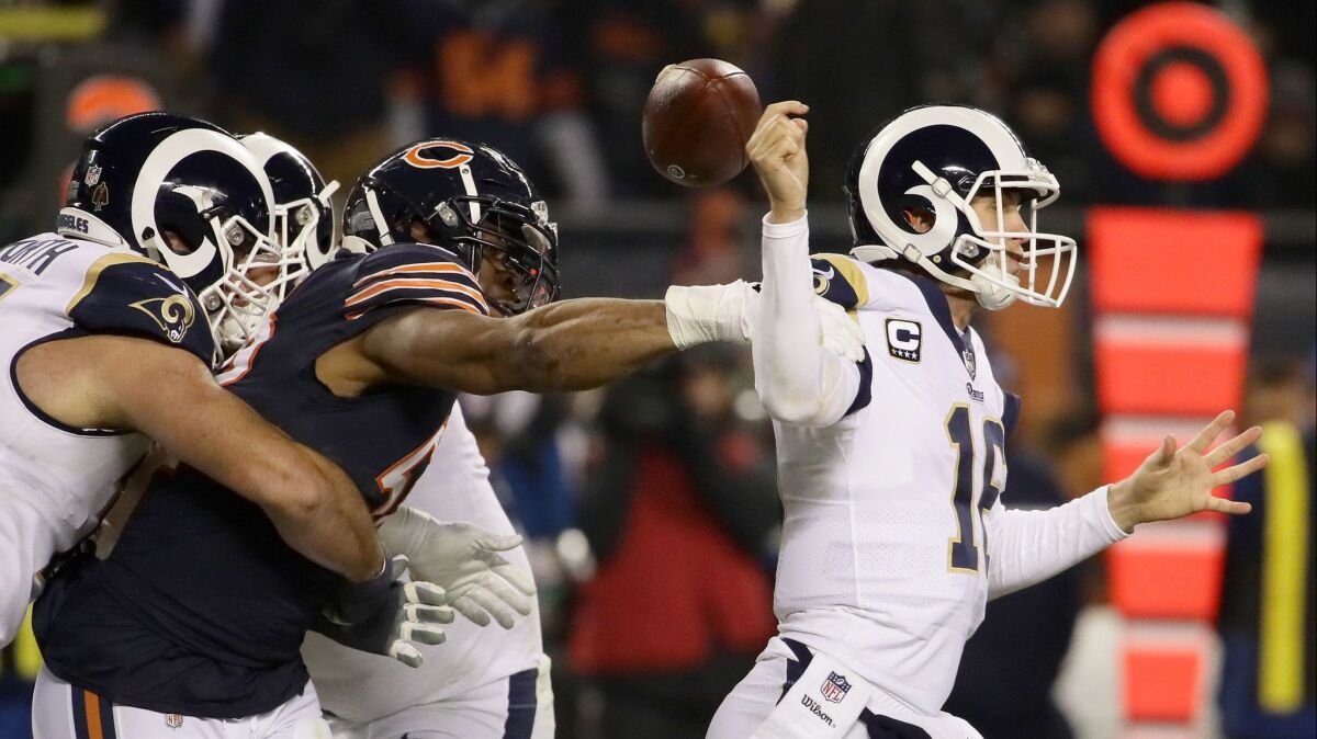 Quarterback Jared Goff of the Rams gets the football stripped by Khalil Mack of the Chicago Bears in the third quarter at Soldier Field.