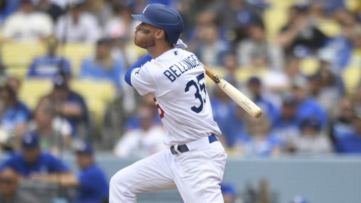 Cody Bellinger watches the flight of his home run during the fourth inning Sunday at Dodger Stadium.