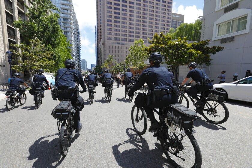 Officers on bicycles from the San Diego Police Department followed a group of protestors downtown in June.