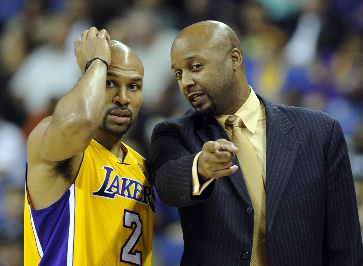 Lakers assistant coach Brian Shaw talks with point guard Derek Fisher during a preseason game in 2010.