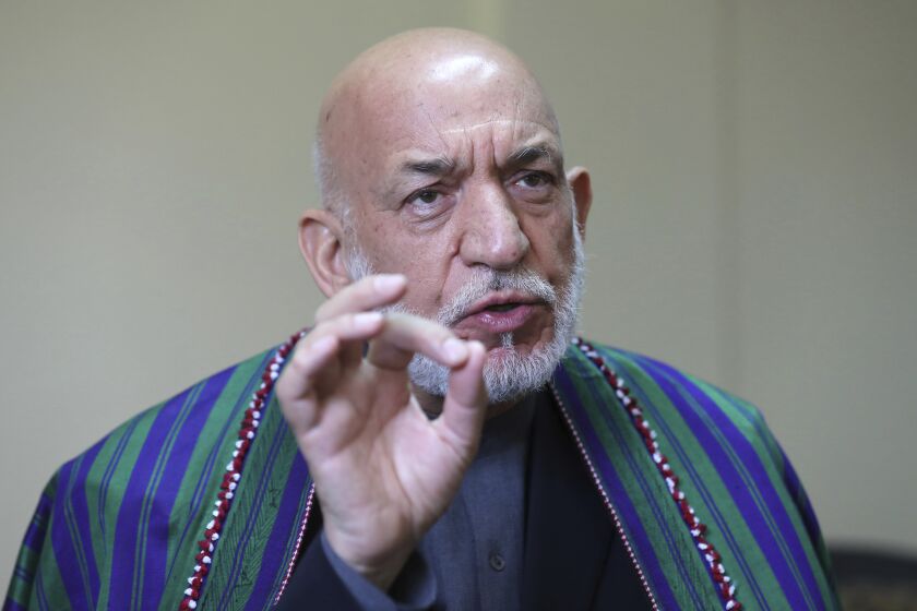 Former Afghan President Hamid Karzai speaks during an interview to the Associated Press in Kabul, Afghanistan, Sunday, June 20, 2021. Karzai said the United States came to Afghanistan to fight extremism and bring stability to his war-tortured nation and is leaving nearly 20 years later having failed at both. (AP Photo/Rahmat Gul)