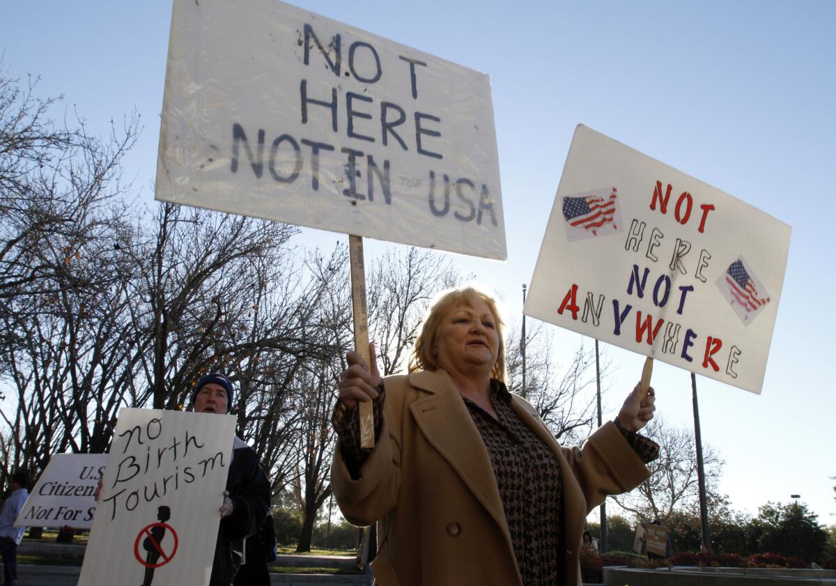 Protesters gather outside San Bernardino County Superior Court as a judge hears a motion for a preliminary injunction against a Chino Hills maternity hotel in 2013.