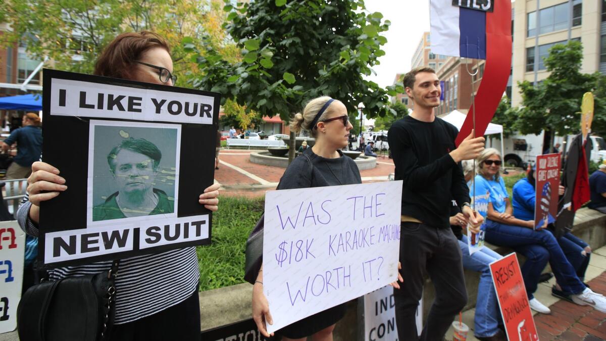 Protesters gather outside court in Alexandria, Va., for the first day of Paul Manafort's trial.