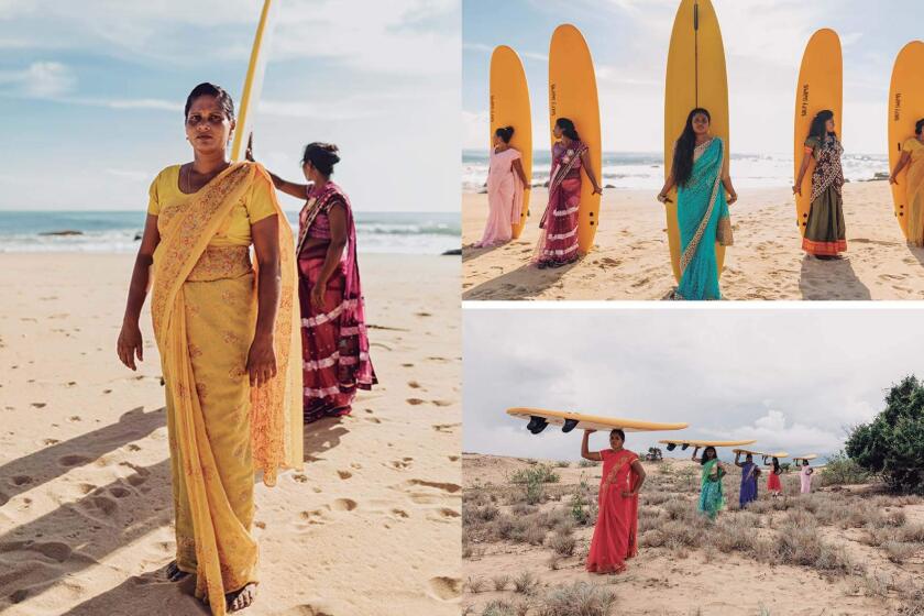 Members of the Arugam Bay Girls Surf Club in Sri Lanka pose for photos as part of the book “Surf Like A Girl.”