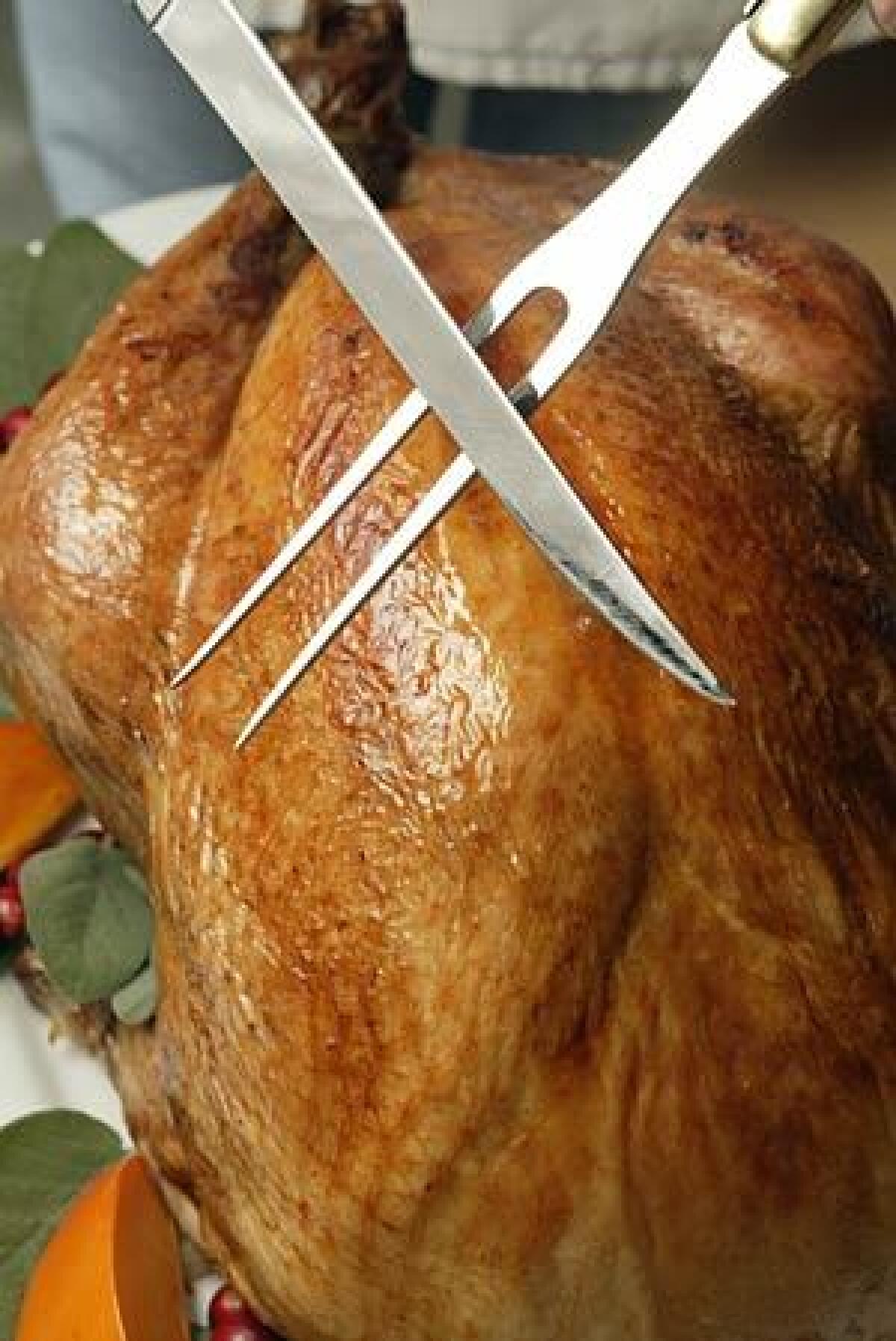 His Laguiole carving set guarantees him the primo Thanksgiving task: slicing the turkey.