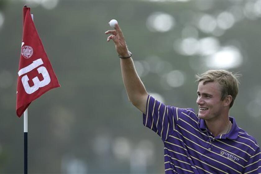 John Peterson reacts after his hole-in-one on the 13th hole during the third round of the U.S. Open Championship golf tournament Saturday, June 16, 2012, at The Olympic Club in San Francisco. (AP Photo/Charlie Riedel)