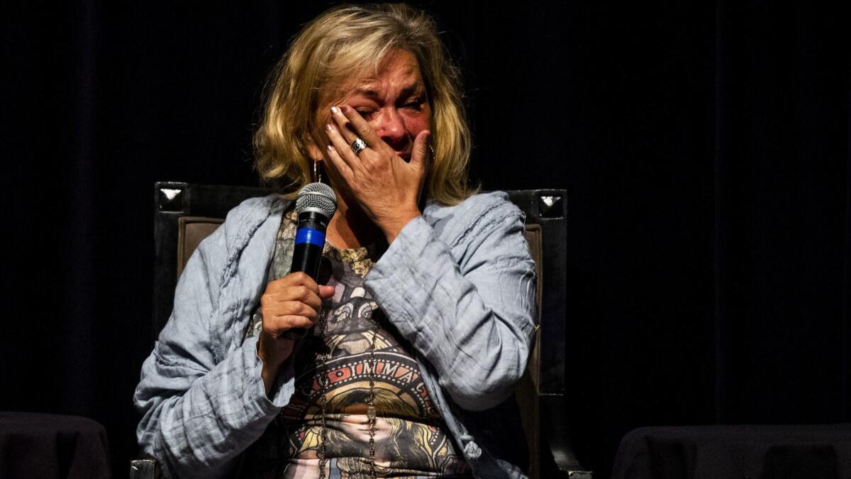 Roseanne Barr wipes away tears during a discussion on atonement and repentance on the eve of Yom Kippur at the Saban Theater.