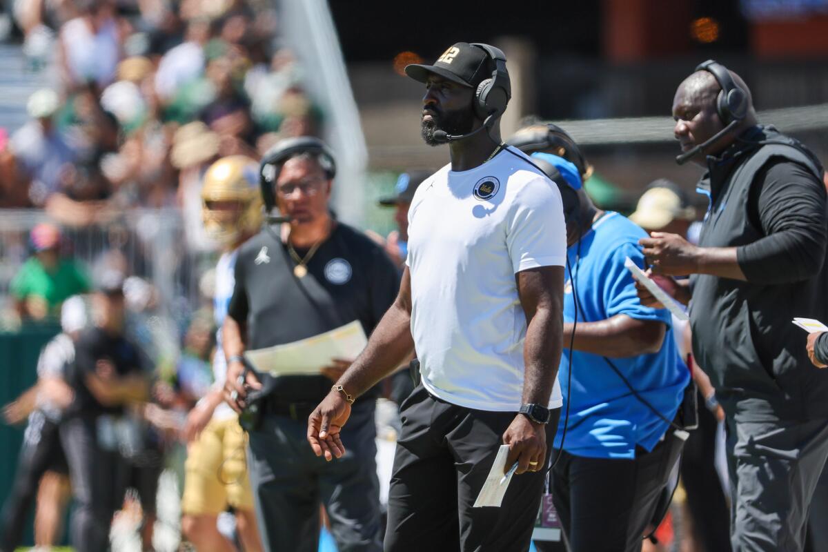 UCLA coach DeShaun Foster watches from the sideline during the Bruins' narrow win over Hawaii 