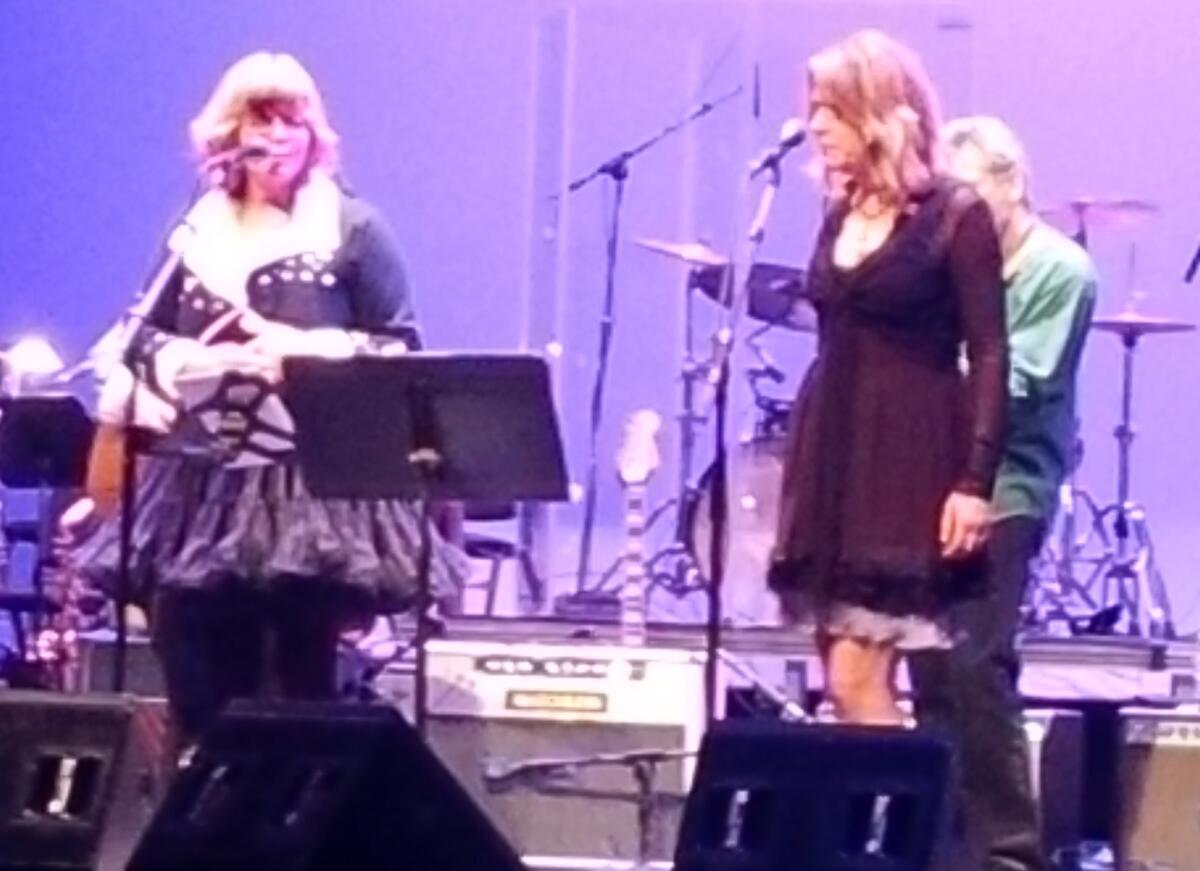 Susan Cowsill, left, and Vicki Peterson of the Bangles perform "Julia" during a complete performance of the Beatles' "White Album" on Saturday during a benefit concert for the Autism Think Tank.