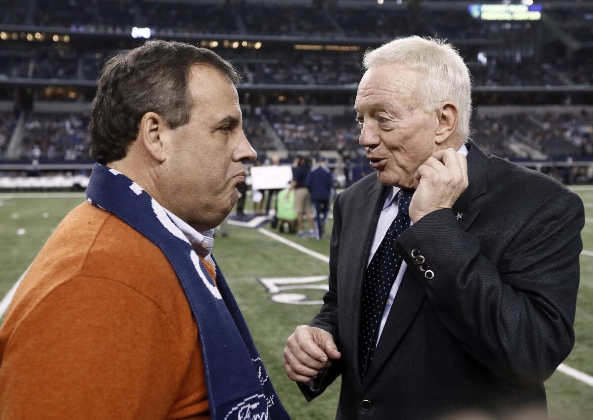 New Jersey Gov. Chris Christie, left, talks with Cowboys team owner Jerry Jones on the field as Dallas and the Indianapolis Colts warm up before a game Dec. 21.