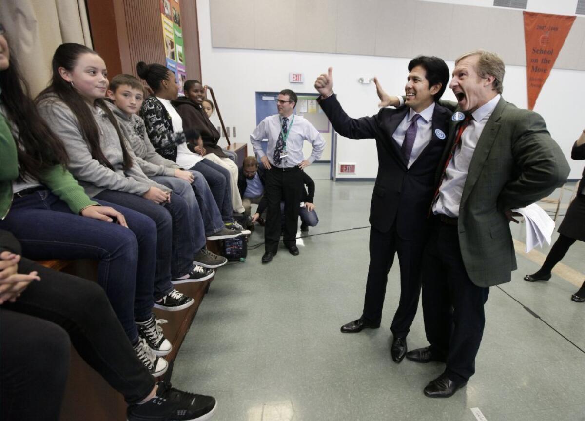 Sen. Kevin de León (D-Los Angeles) joins Tom Steyer, right, who bankrolled the campaign for Proposition 39, at a Sacramento event promoting the ballot initiative on Dec. 4, 2012.