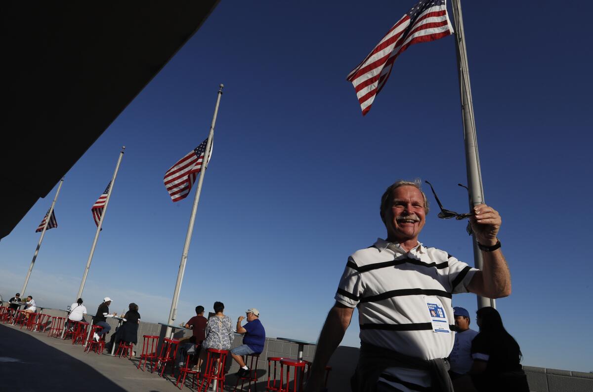 Los Angeles Times columnist Chris Erskine walks around the top deck of Dodger Stadium