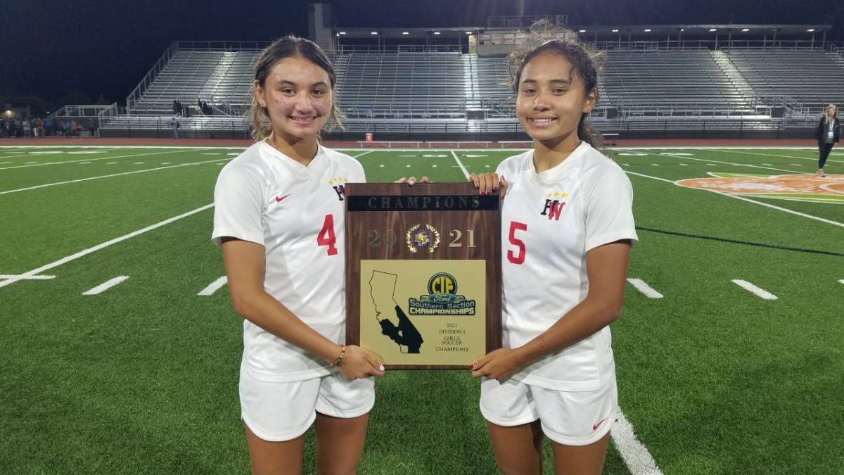 Harvard-Westlake soccer players Gisele and Alyssa Thompson with the Southern Section soccer plaque.