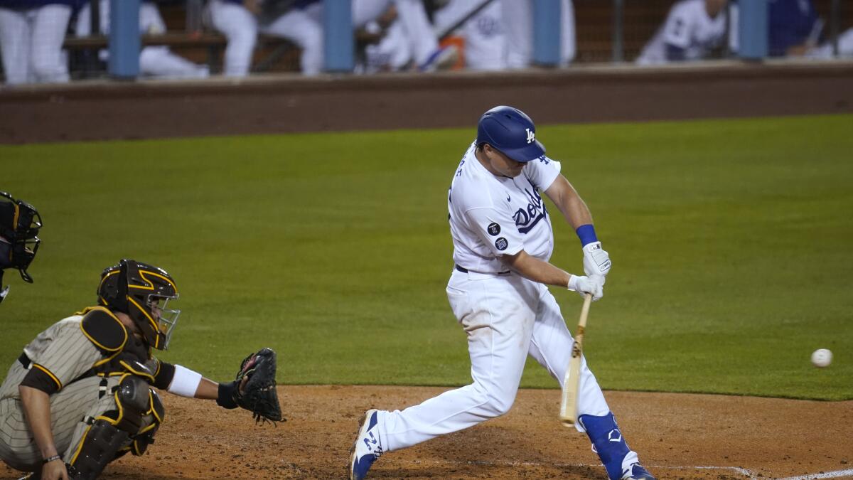 MILWAUKEE, WI - AUGUST 17: Los Angeles Dodgers left fielder Chris Taylor  (3) bats during an MLB game against the Milwaukee Brewers on August 17,  2022 at American Family Field in Milwaukee