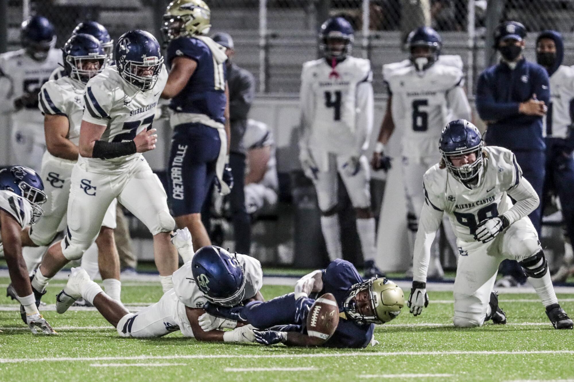 St. John Bosco running back Jabari Bates fumbles the ball.