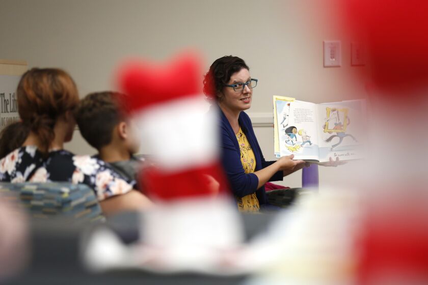 Colleen Garcia reads Dr. Seuss’s new book Horse Museum to children at UC San Diego's Geisel Library on Tuesday, Sept. 3, 2019. The school celebrated the release of a previously unpublished book by Dr. Seuss, the pseudonym for the late La Jolla author Theodor Geisel. The new book is titled Dr. Seuss’s Horse Museum and “is based on a manuscript and sketches by Dr. Seuss that was discovered in 2013,” according to UC San Diego. “It includes cameos by classic Dr. Seuss characters, such as the Cat in the Hat and the Grinch, while featuring whimsical illustrations inspired by Dr. Seuss’s original sketches.”