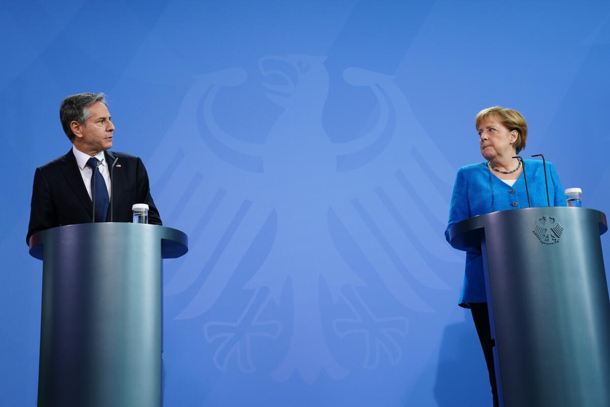 German Chancellor Angela Merkel, right, and U.S. Secretary of State Antony J. Blinken