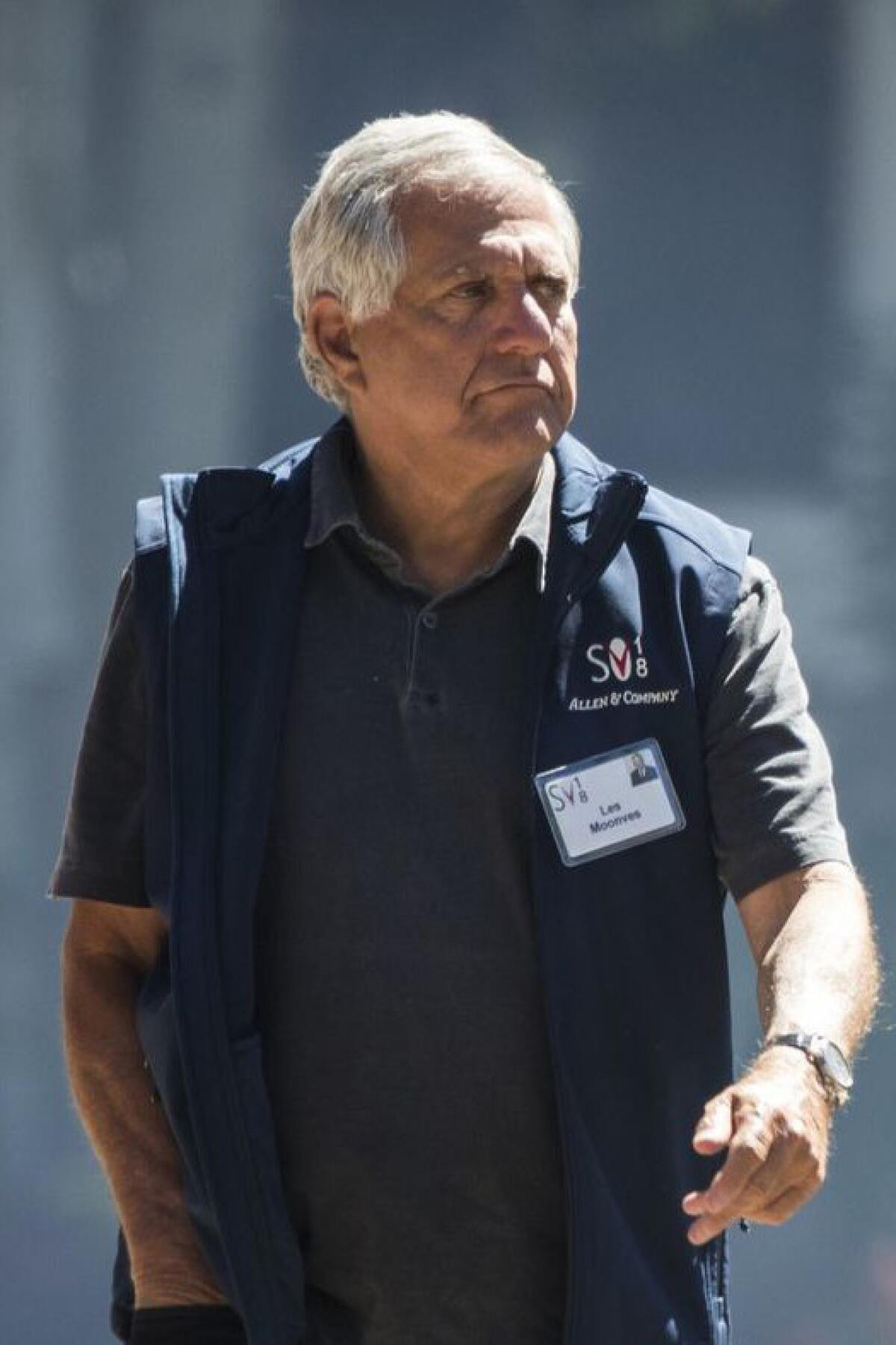 Leslie Moonves walks outdoors