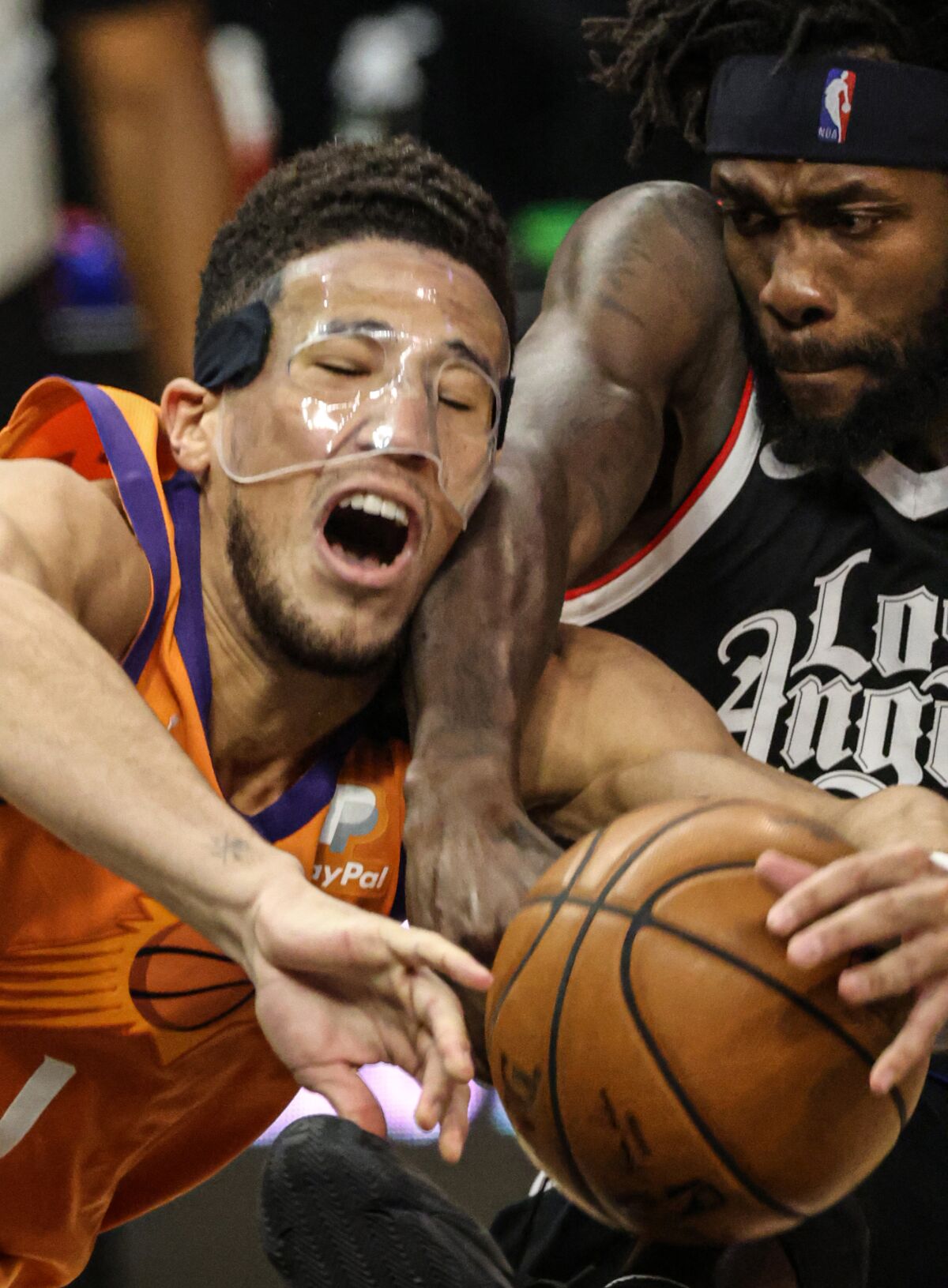 Clippers guard Patrick Beverley fouls Suns guard Devin Booker during Game 3.