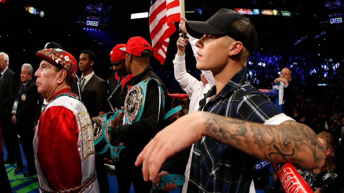 Justin Bieber hangs out in the ring before the bout between Floyd Mayweather Jr. and Andre Berto in Las Vegas on Saturday.