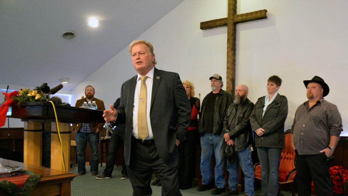 Republican Kentucky state Rep. Dan Johnson addresses the public from his church Tuesday, denying allegations that he sexually abused a teenager after a New Year's party in 2013.