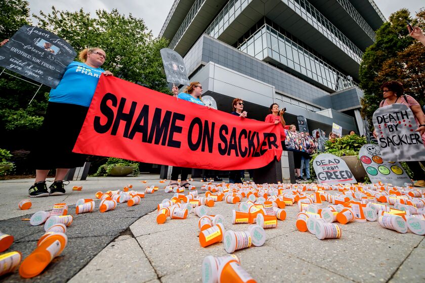 Members of P.A.I.N. (Prescription Addiction Intervention Now) and Truth Pharm staged a protest on Sept. 12, 2019 outside Purdue Pharma headquarters in Stamford, over their recent controversial opioid settlement. (Erik McGregor/Zuma Press/TNS) ** OUTS - ELSENT, FPG, TCN - OUTS **