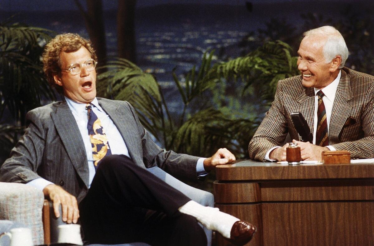 "Late Night with David Letterman" host David Letterman, left, appears with host Johnny Carson during a taping of "The Tonight Show" in 1991.