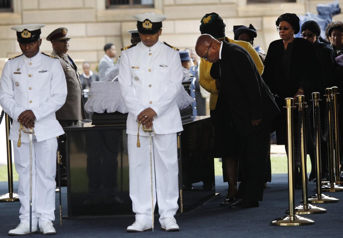 South African President Jacob Zuma pays his respects as the body of former President Nelson Mandela lies in state at the Union Buildings in Pretoria.