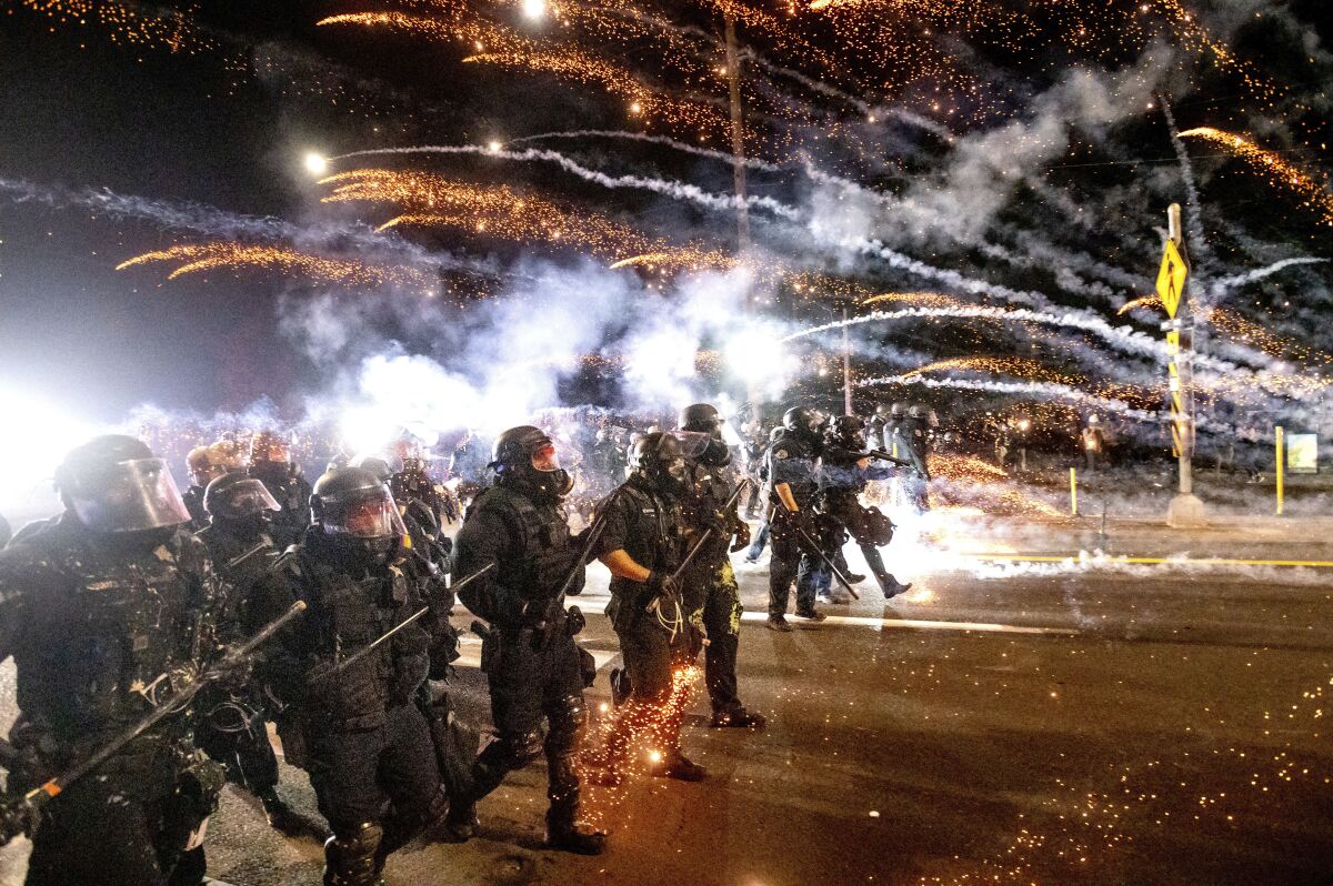 Police disperse protesters demanding racial justice in Portland, Ore., on Sept. 5.