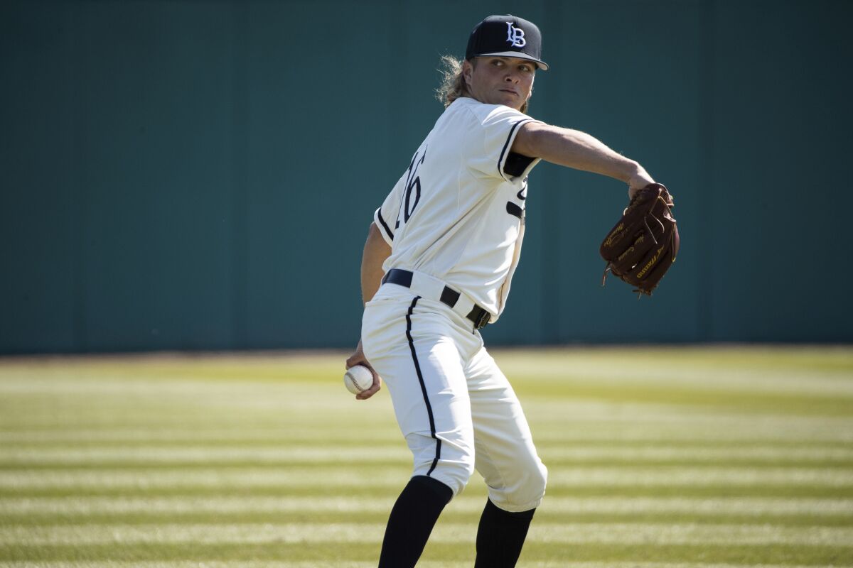 Long Beach State pitcher Adam Seminaris warms up prior to a game on Feb. 24, 2019.