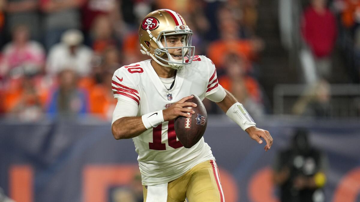 San Francisco 49ers quarterback Jimmy Garoppolo looks to pass the football.
