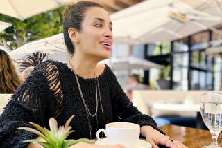 Professional poker player Robbi Jade Lew wears a ruby ring while having coffee at a Beverly Hills Cafe.