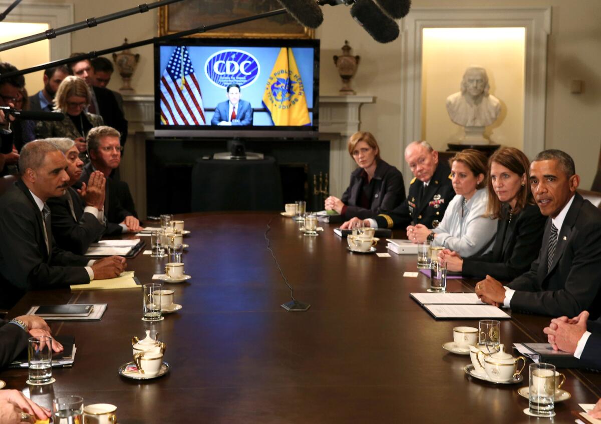 President Obama speaks with members of his cabinet about the fight against the Ebola virus during a meeting at the White House.
