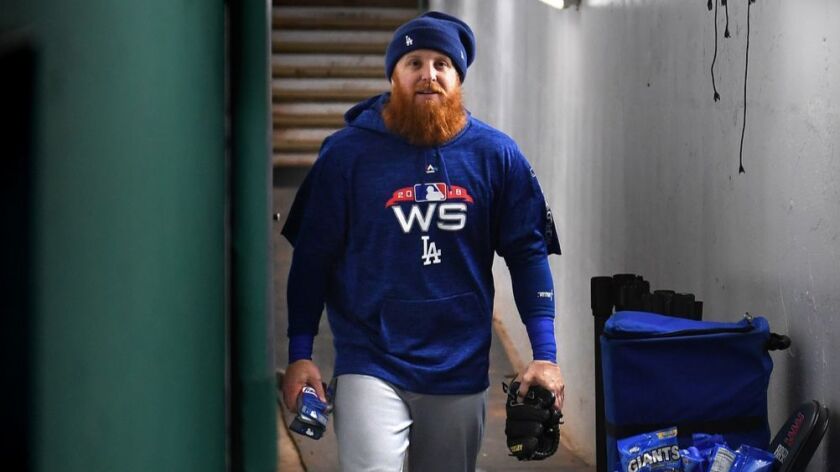Dodgers third baseman Justin Turner heads to the field at Fenway Park for a workout during the World Series.