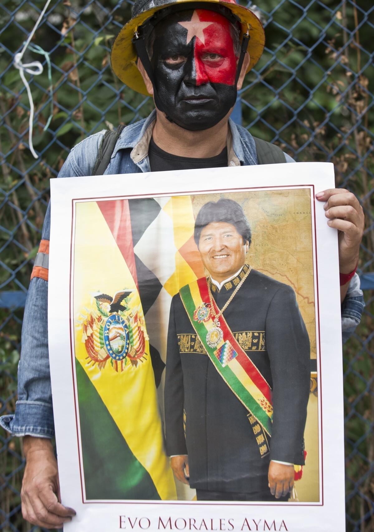 A man shows a poster of Bolivian President Evo Morales during a protest in support of the Bolivian leader in front of the U.S. Embassy in Mexico City on July 4. Many Latin Americans were angered after some European nations temporarily refused Morales' plane access to their airspace amid suspicions U.S. fugitive Edward Snowden was aboard.