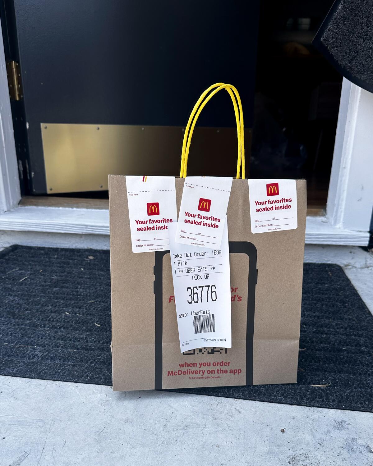A delivery from McDonald's sits on a doorstep.