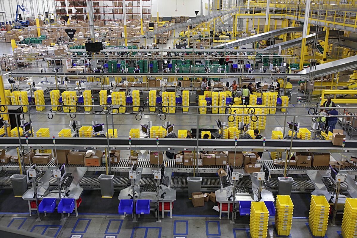 Workers at Amazon's warehouse in San Bernardino in 2013.