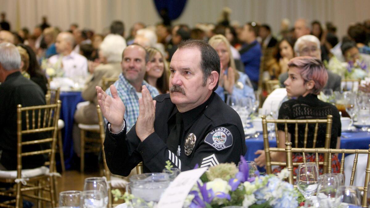 Glendale police Sgt. Ben Bateman enjoys the 2016 Glendale Police Awards Luncheon held at the Glendale Civic Auditorium on Thursday, May 12, 2016.