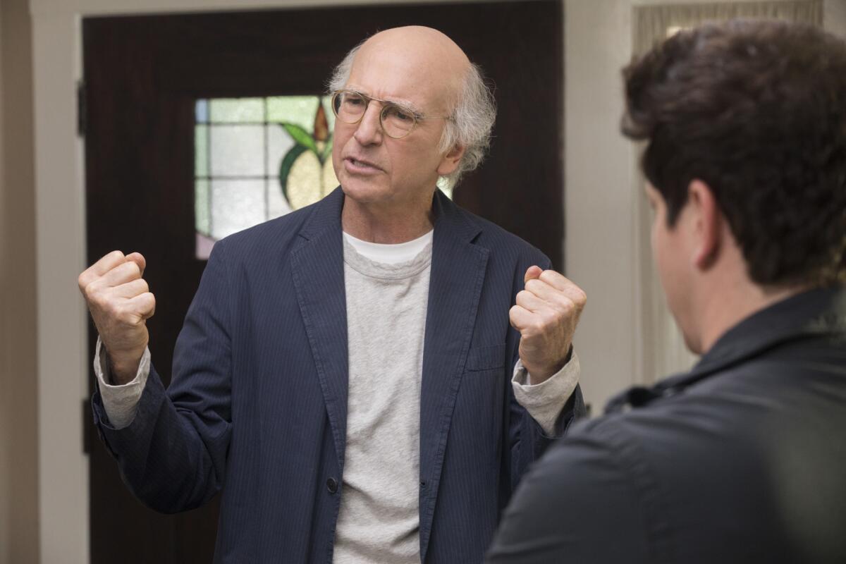 An older man clenches his fists in "Curb Your Enthusiasm." 