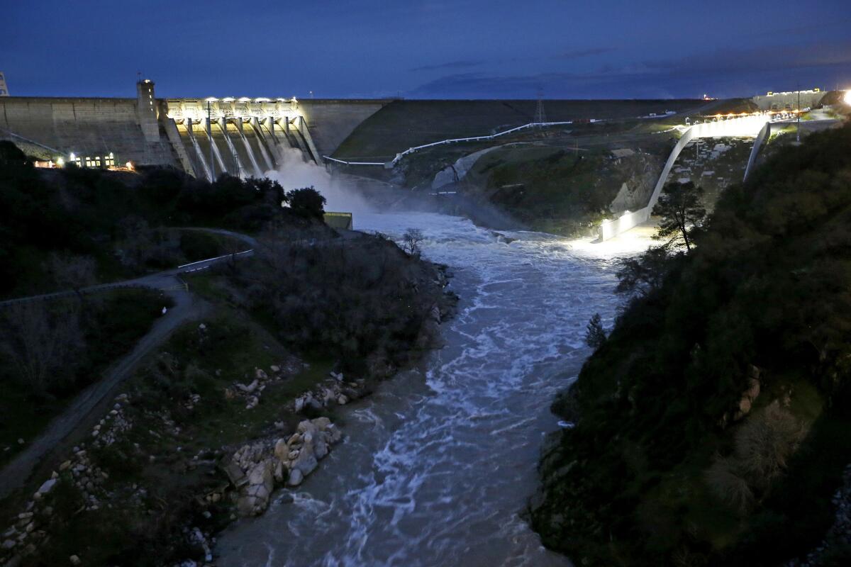 Water is released from Folsom Dam into the American River in Folsom, Calif.