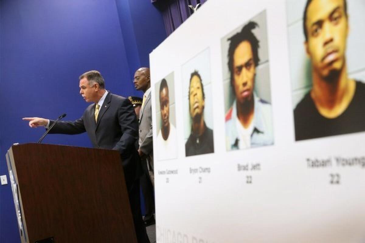 Chicago Police Supt. Garry McCarthy announces arrests have been made in Thursday's mass shooting at Cornell Square Park during a press conference Chicago. The suspects, whose pictures were on display at the press conference, includefrom left, Kewane Gatewood, 20; Bryon Champ, 21; Brad Jett, 22; and Tabari Young, 22.