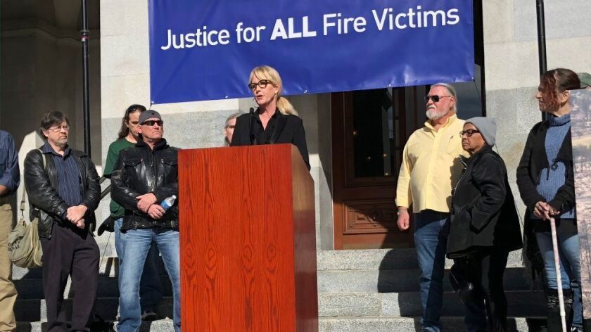 Consumer advocate Erin Brockovich, outside the state Capitol on Tuesday, has urged lawmakers not to let PG&E go bankrupt.