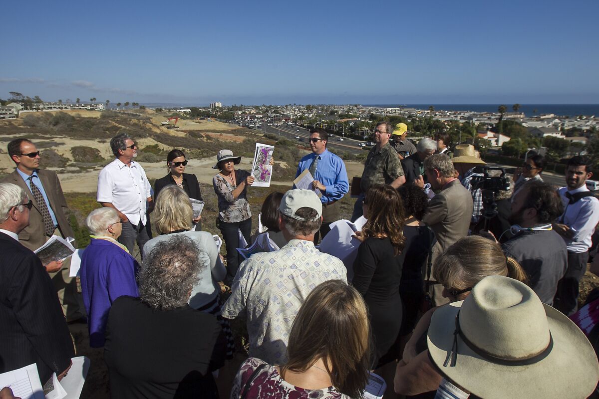 Coastal Commission staff members Karl Schwing and Jonna Engel lead a field trip for commissioners, staff and the general public of a proposed development project at Banning Ranch near Newport Beach on Wednesday.