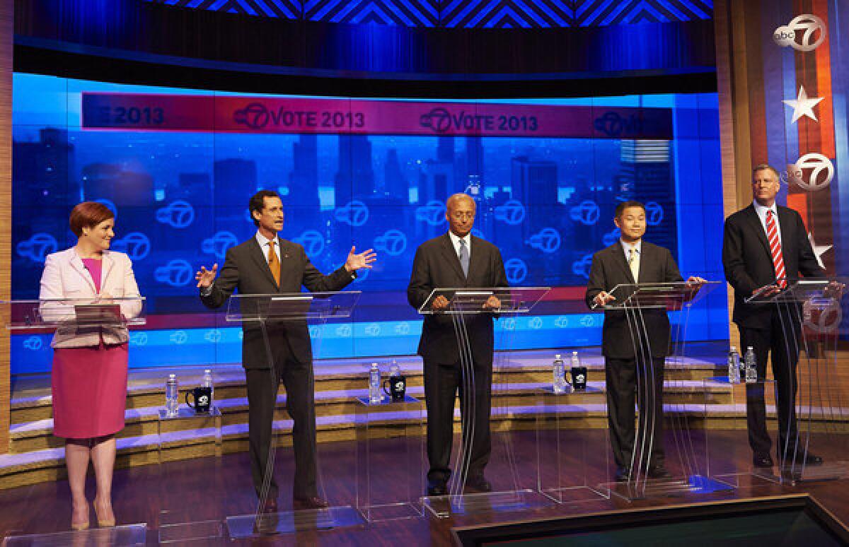 Anthony Weiner, second from left, responds to a question during a debate with four of his rivals in the Democratic primary.