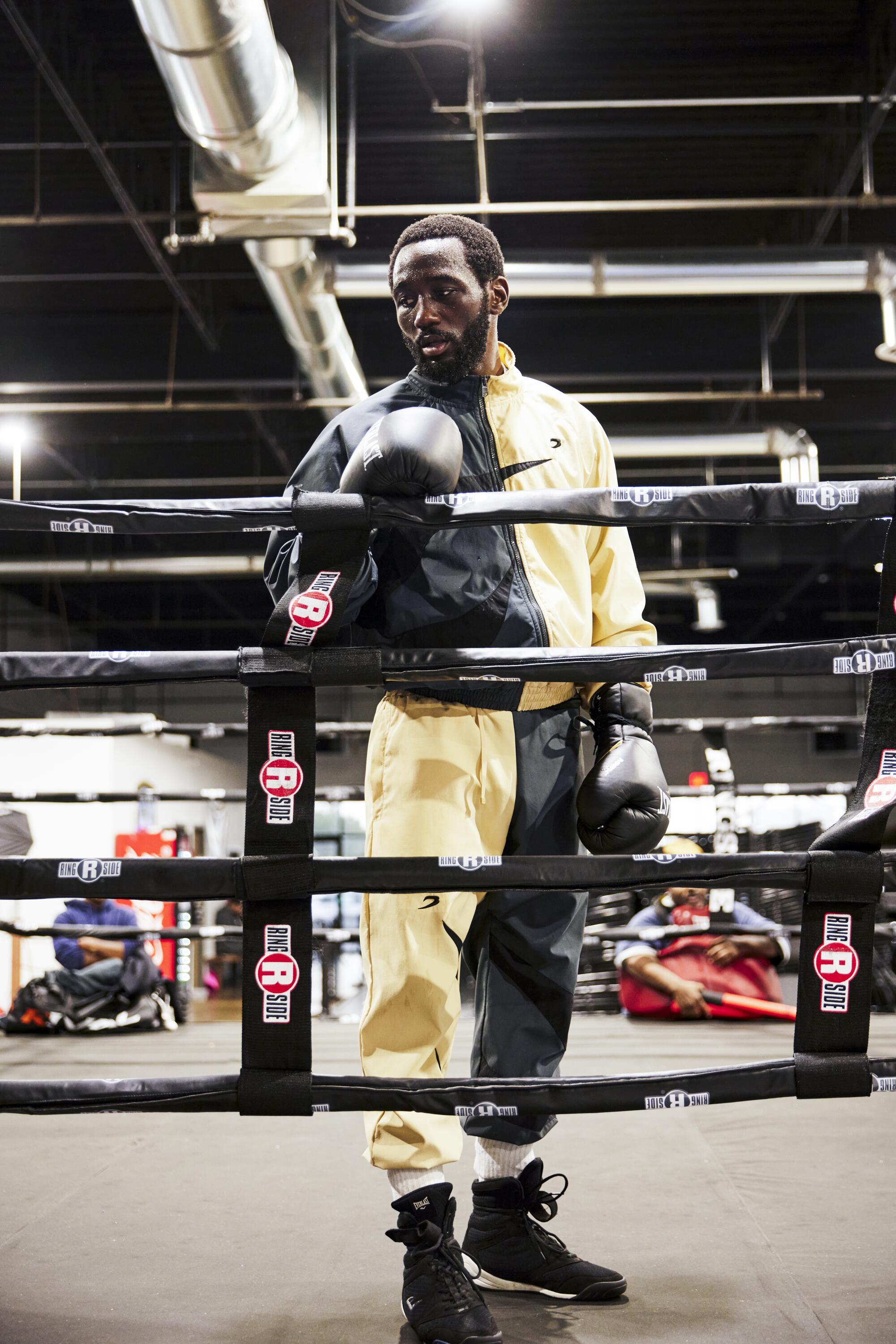 Terence "Bud" Crawford stands near the ring during a training session at the Triple Threat Boxing Gym in Colorado Springs 