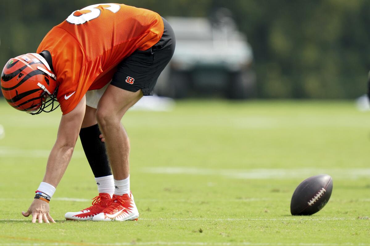 Cincinnati Bengals quarterback Joe Burrow (9) runs onto the field