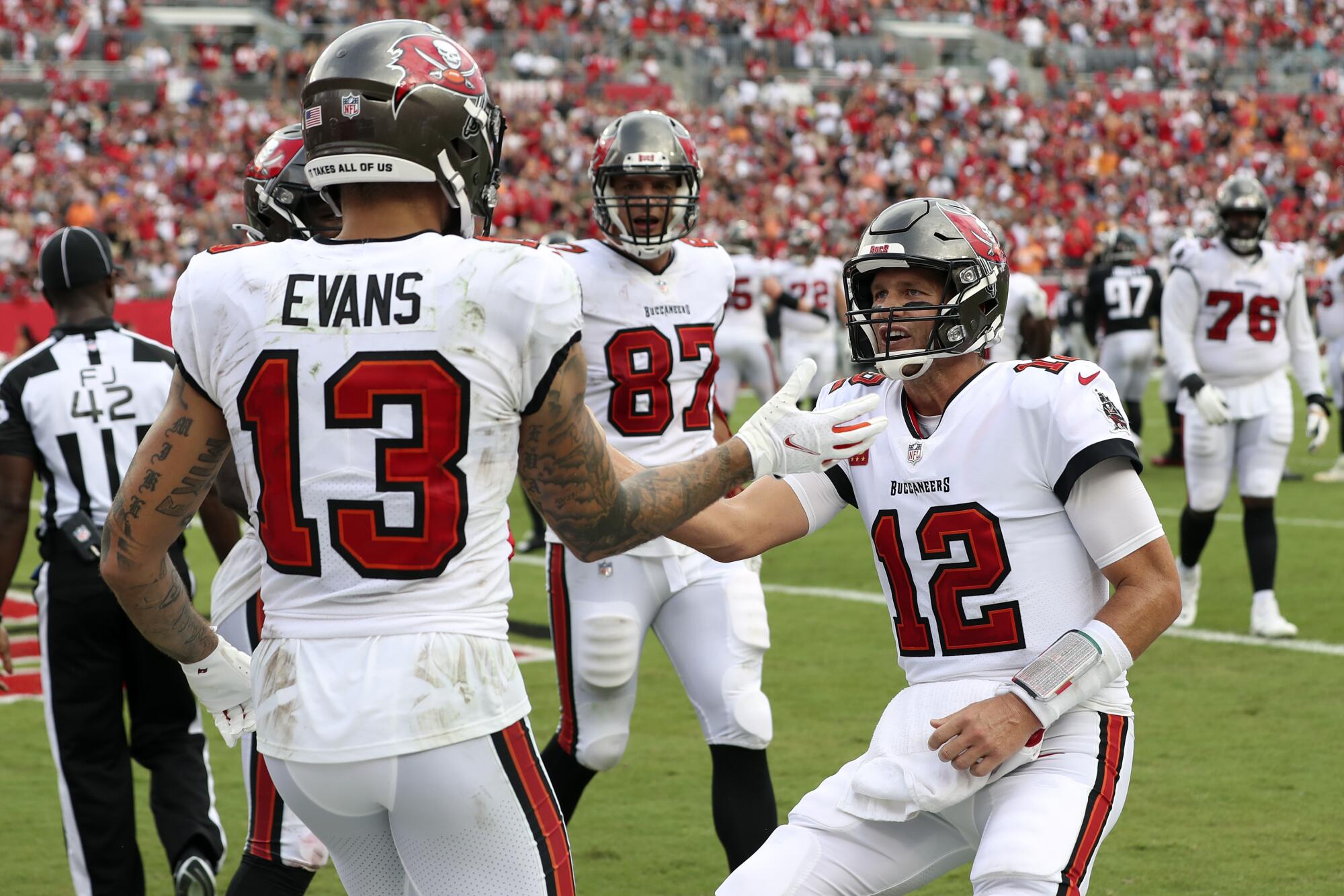 Tampa Bay Buccaneers quarterback Tom Brady celebrates with wide receiver Mike Evans.